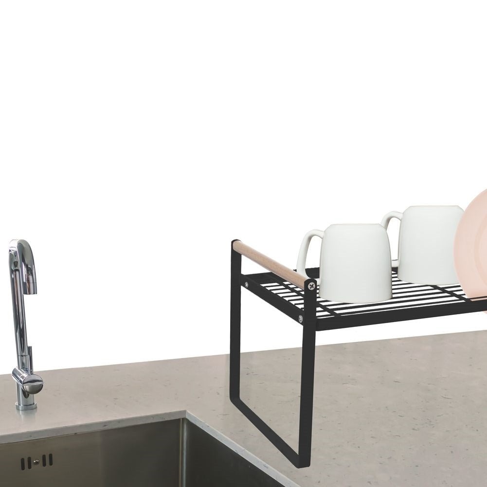 Elegant kitchen shelf in black metal and wood for order in the home