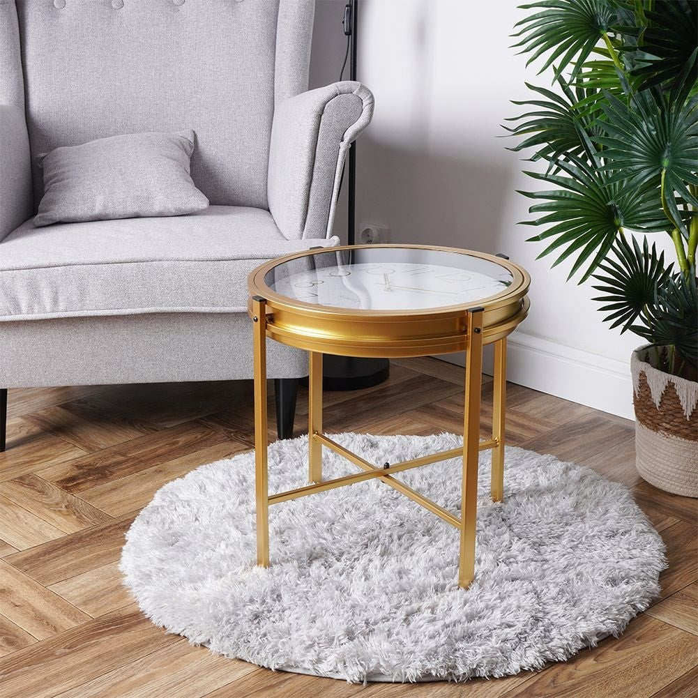 Elegant metal coffee table with built-in clock and golden finish