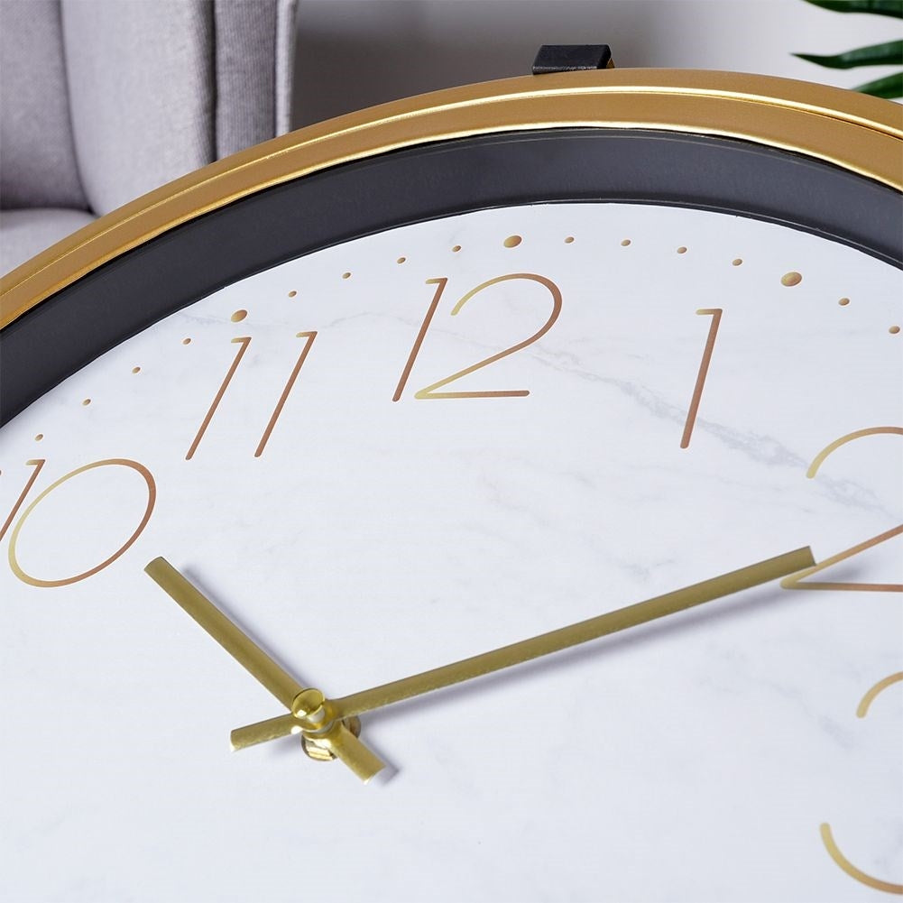 Elegant metal coffee table with built-in clock and golden finish
