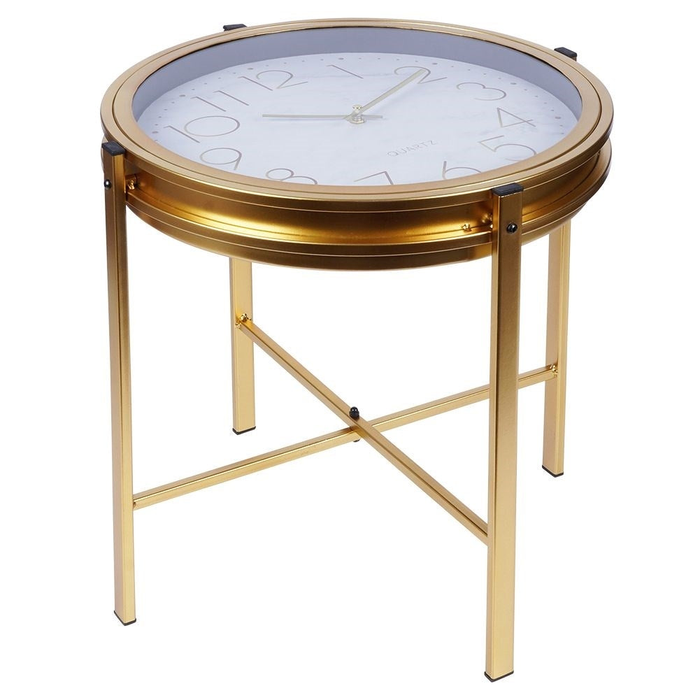 Elegant metal coffee table with built-in clock and golden finish