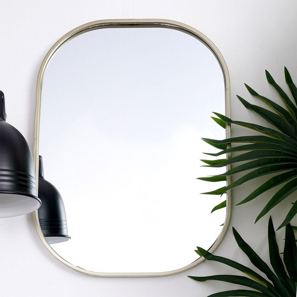 Elegant oval wall mirror with champagne gold metal frame