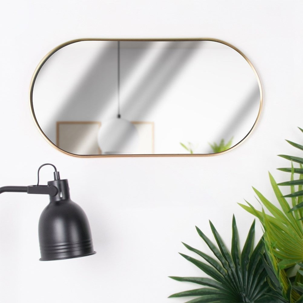 Elegant oval wall mirror with gold metal frame, flexible suspension