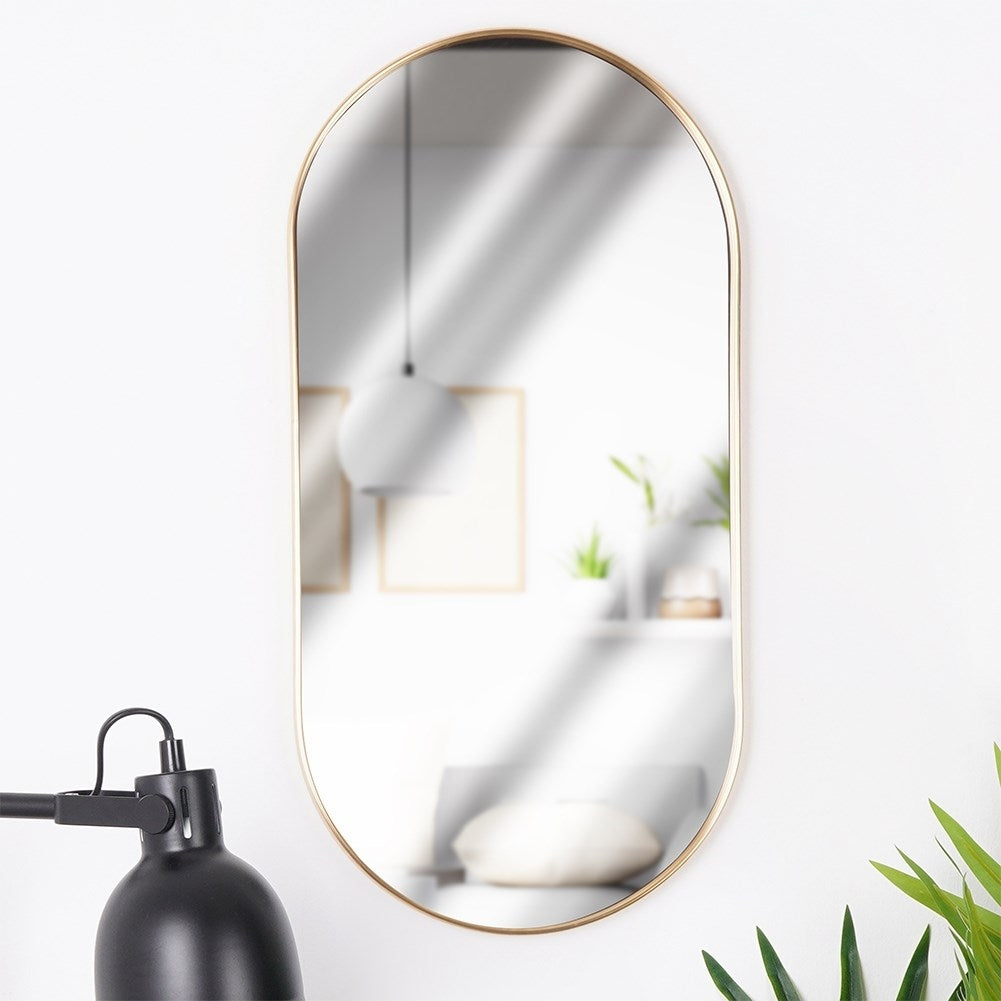 Elegant oval wall mirror with gold metal frame, flexible suspension