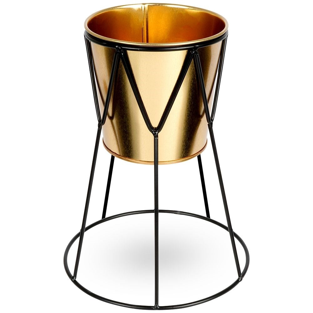 Elegant pot in gold with stylish black metal stand