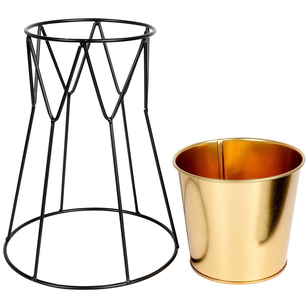 Elegant pot in gold with stylish black metal stand