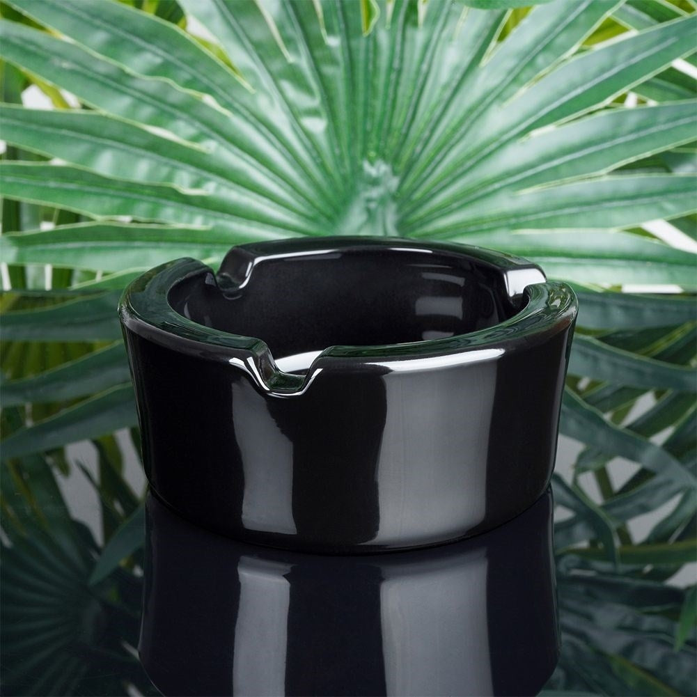 Elegant round ashtray in black glass for home & garden