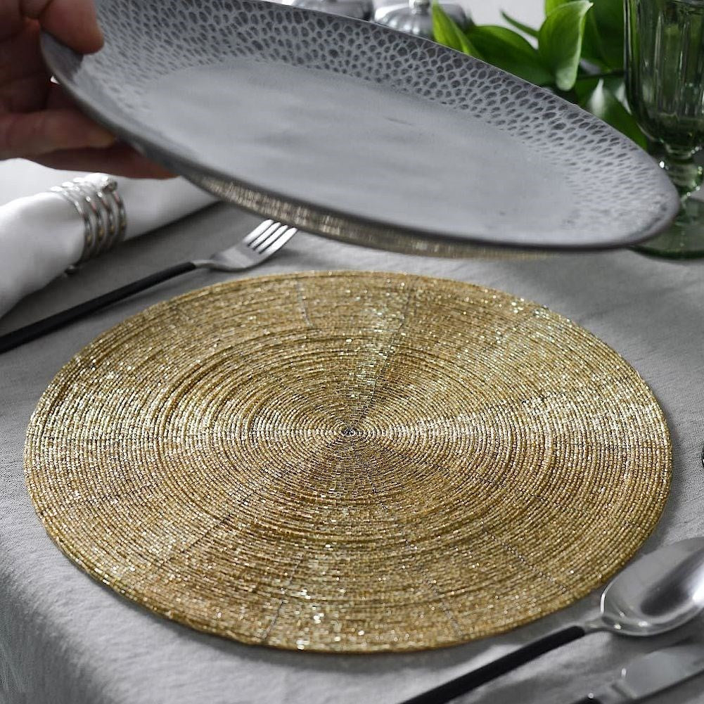 Elegant round placemat in trendy golden colour