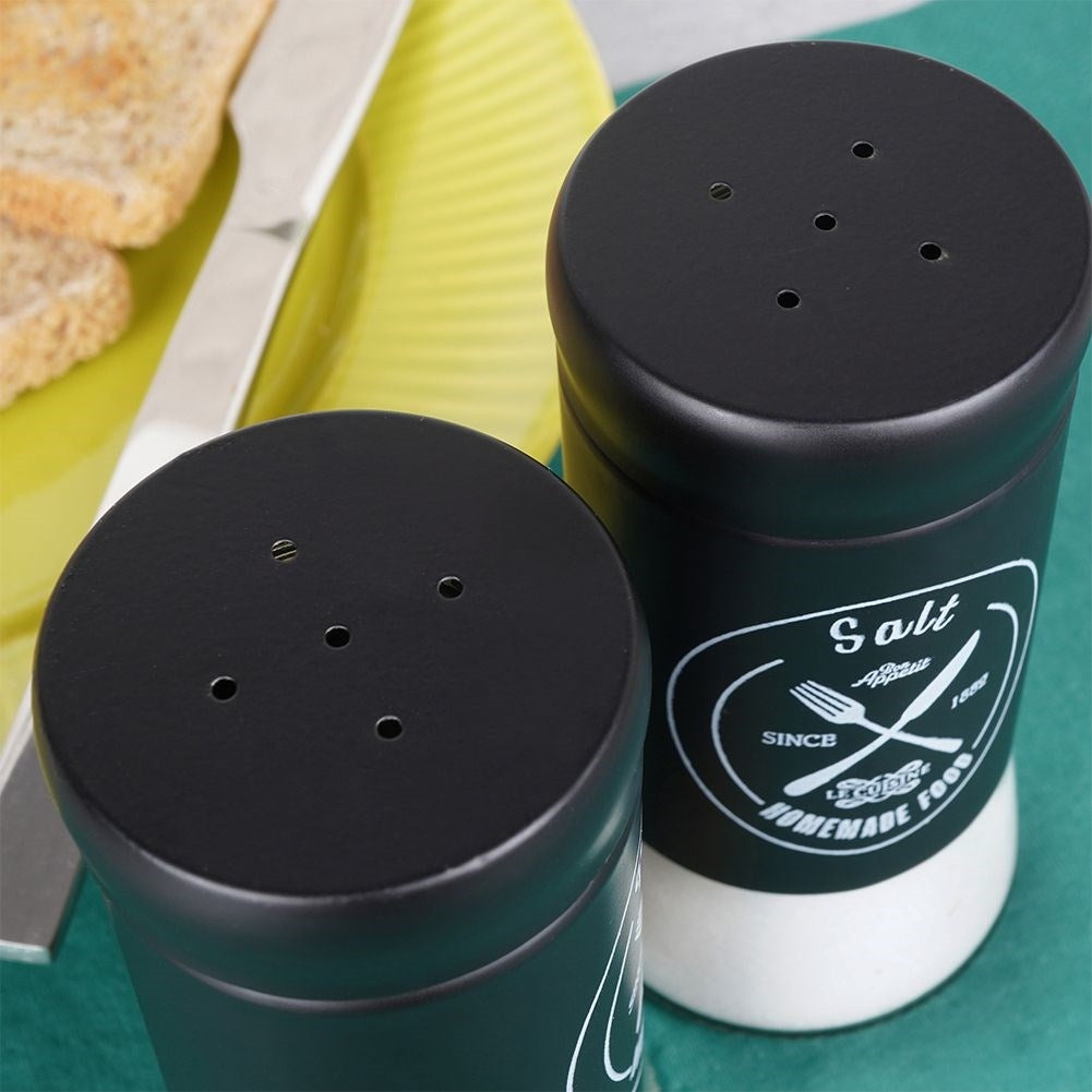 Elegant serving set in glass and black metal for salt & pepper