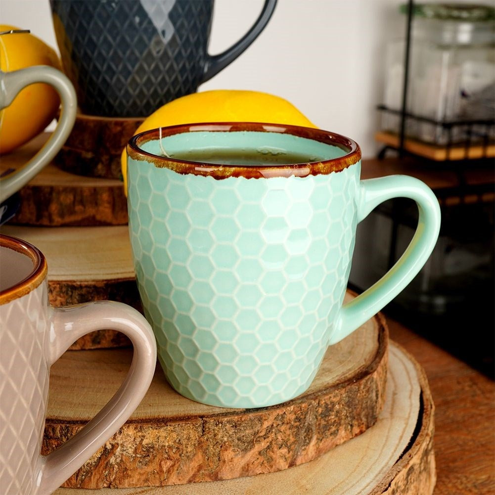 Elegant set of decorated ceramic cups in a gift box