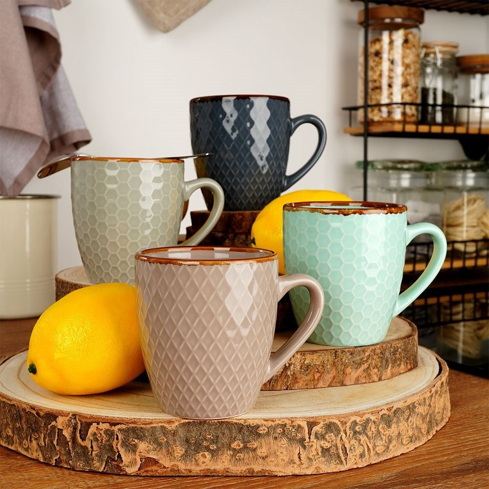Elegant set of decorated ceramic cups in a gift box