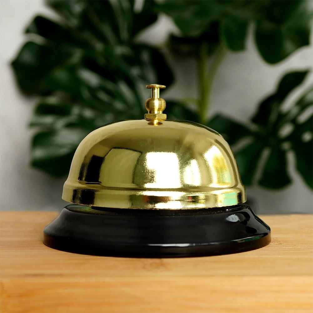 Elegant table clock in gold metal with black base