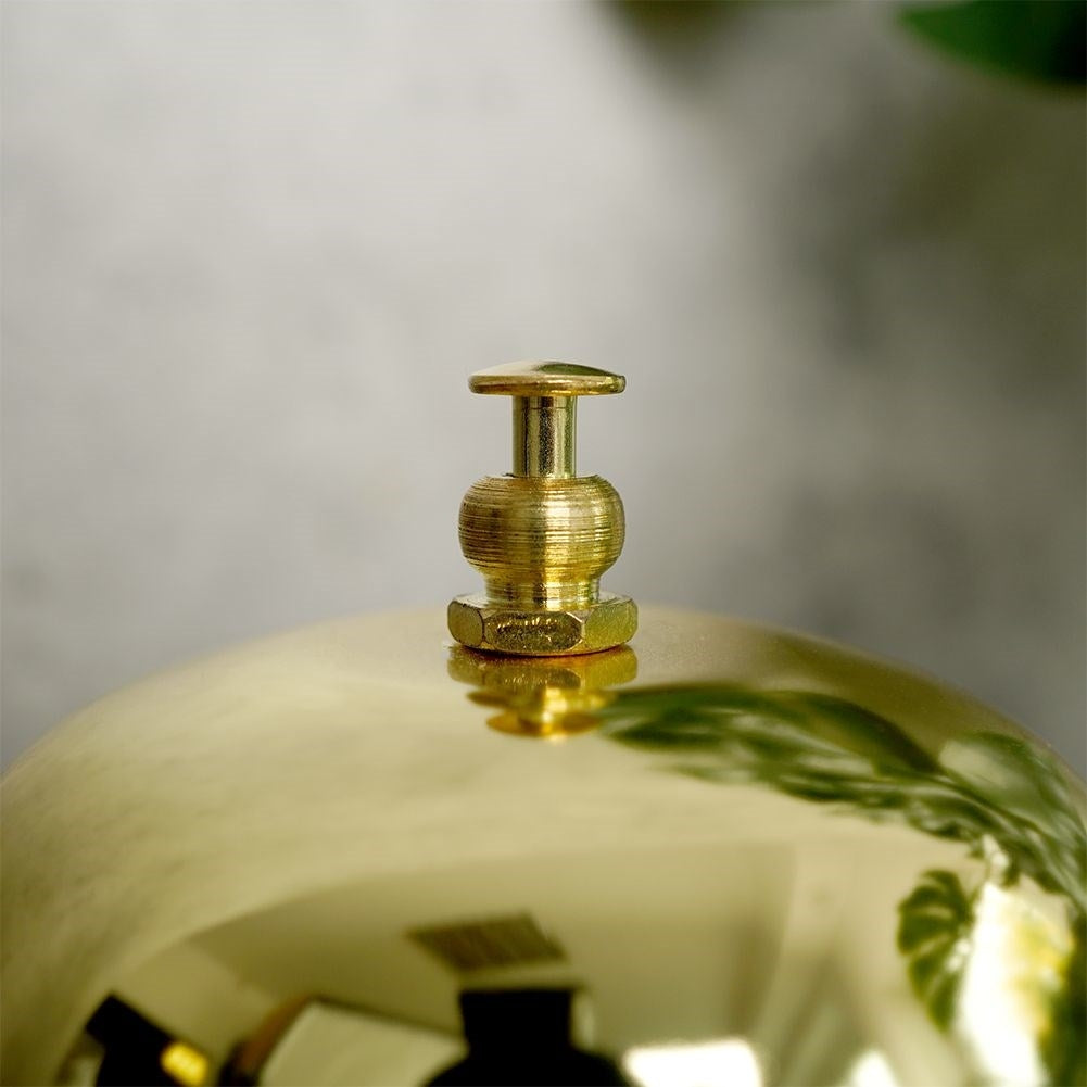 Elegant table clock in gold metal with black base