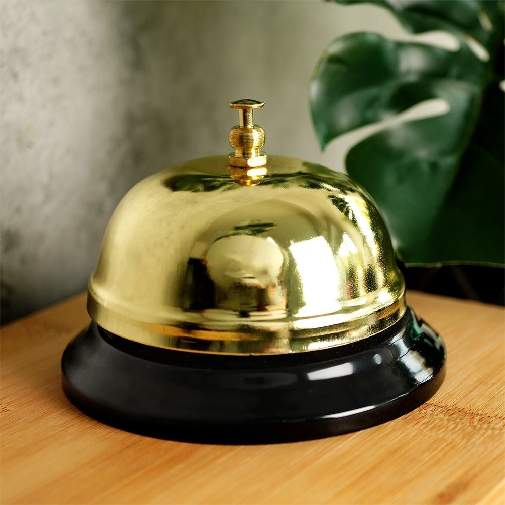Elegant table clock in gold metal with black base