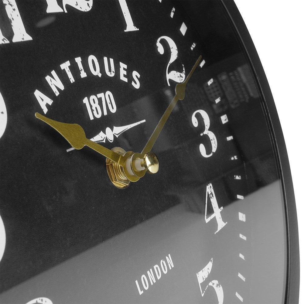 Elegant two-sided watch with a black dial and golden hands