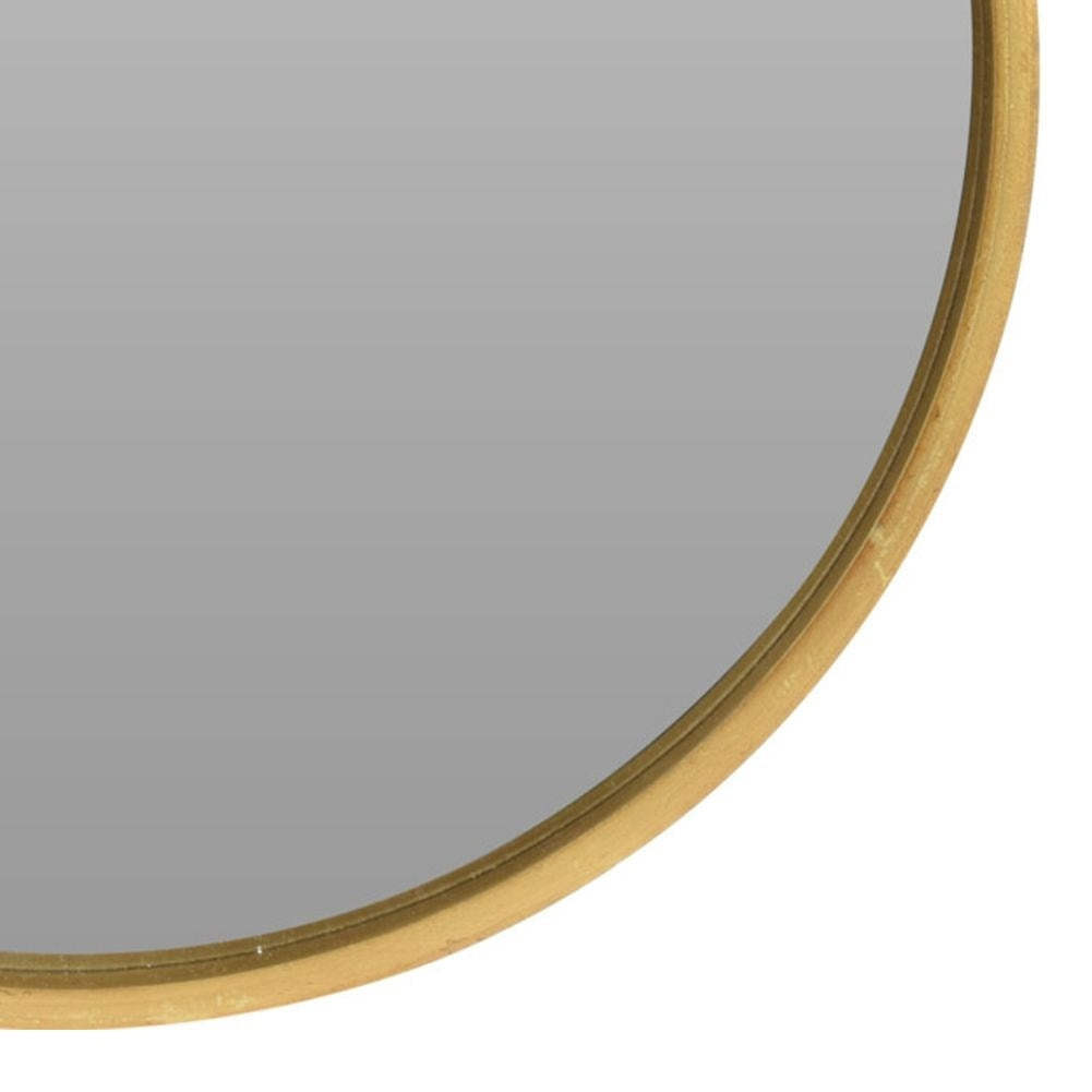Elegant wall-hung mirror in gold wooden frame