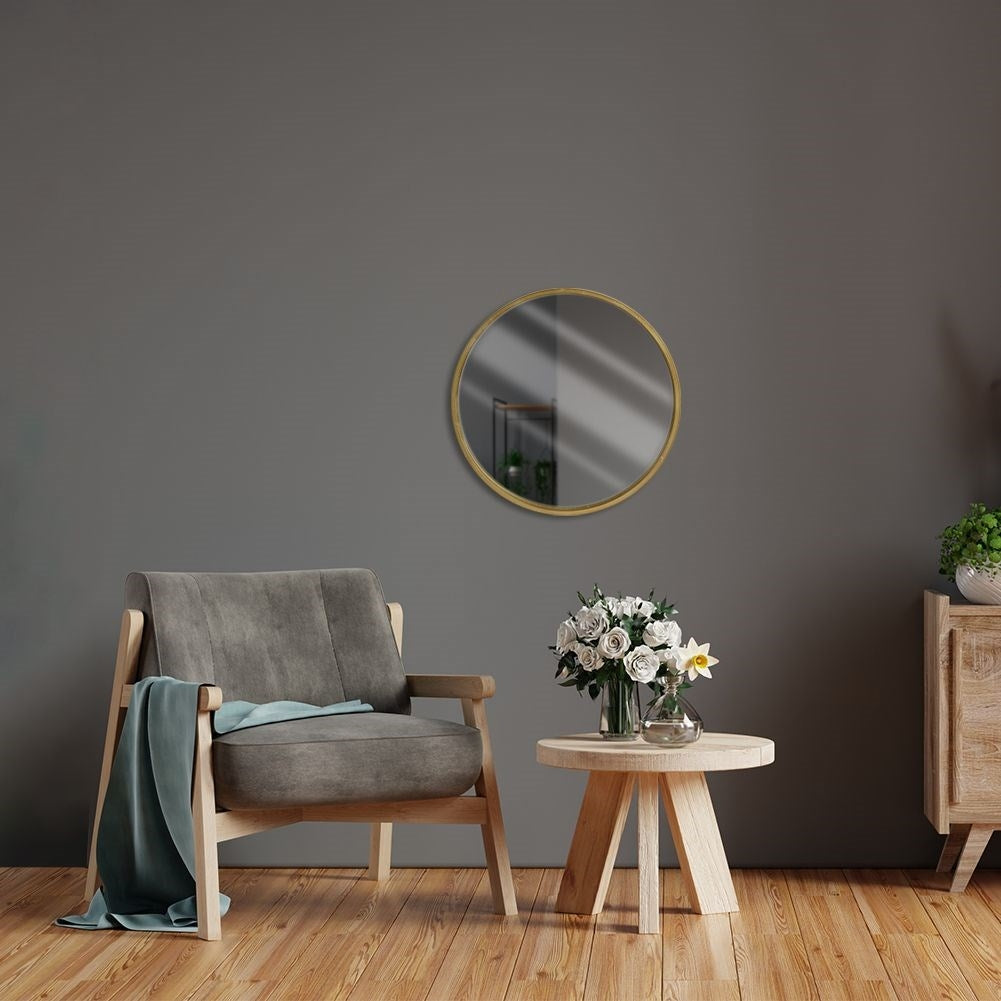 Elegant wall-hung mirror in gold wooden frame