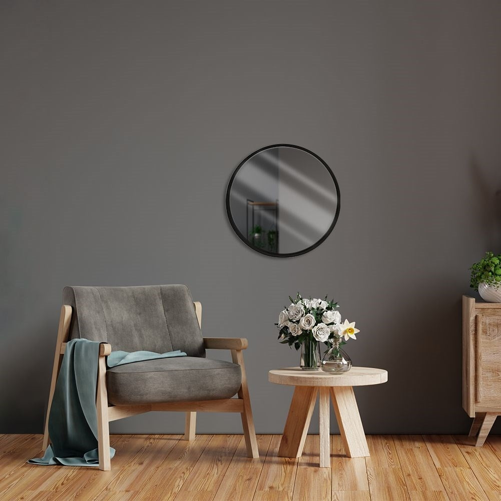 Elegant wall mirror with black wooden frame for any room
