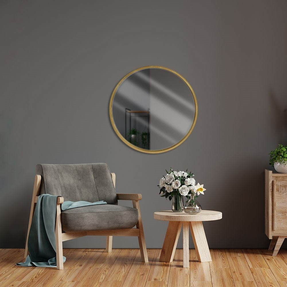 Elegant wall mirror with gold wooden frame for luxurious interior design