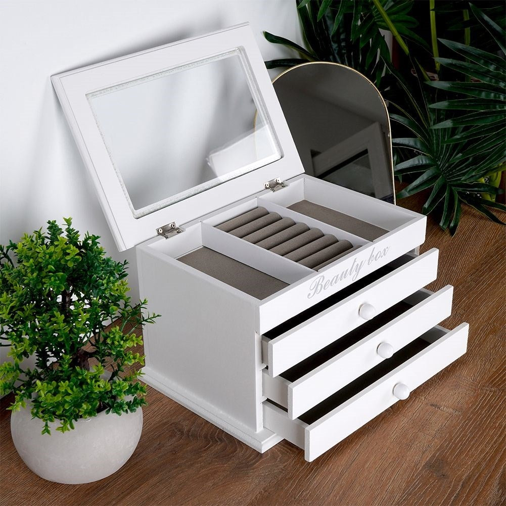 Elegant white jewelry box with glass lid and three drawers