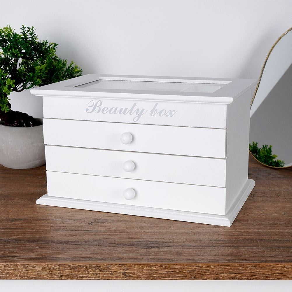 Elegant white jewelry box with glass lid and three drawers