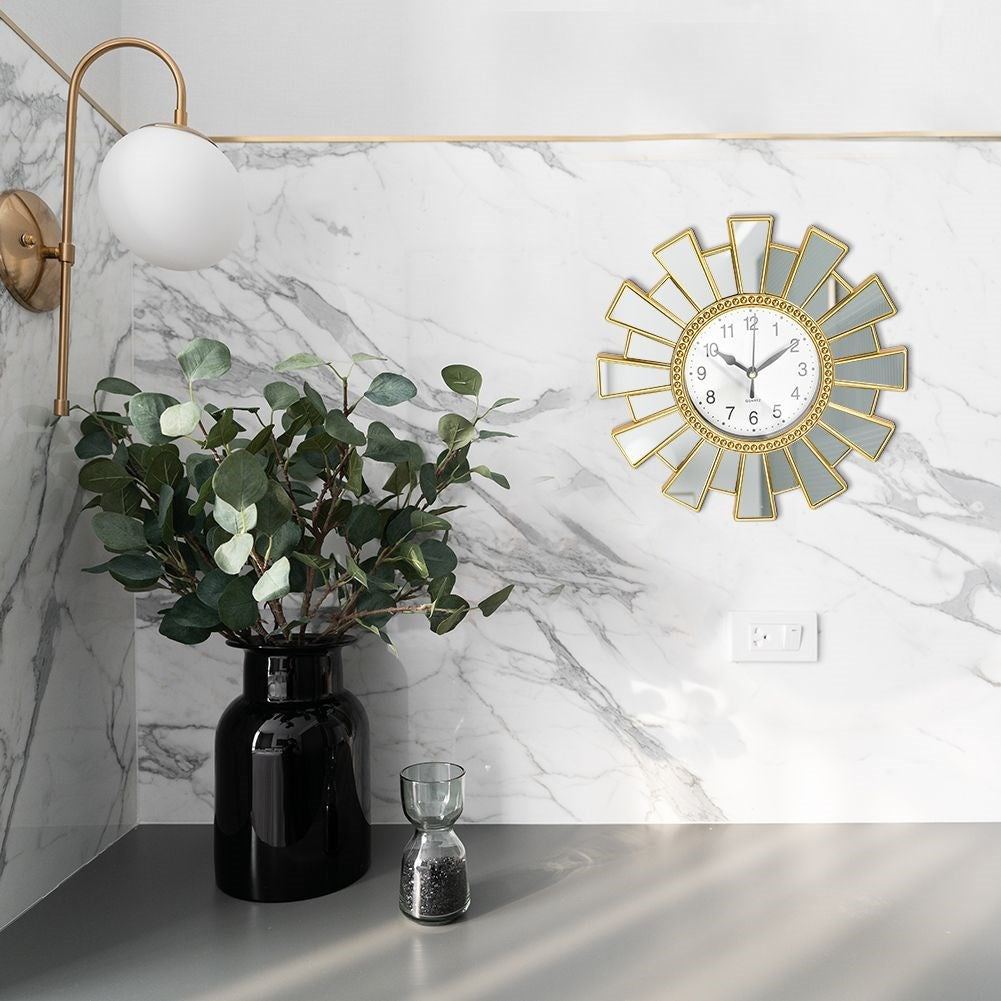 Exclusive Wall Clock 25cm with mirror element and gold plating