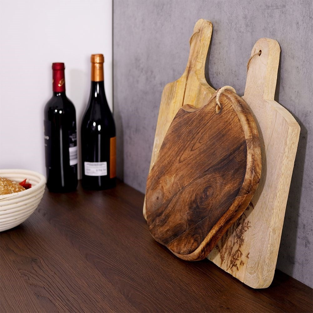 Exotic mango wood kitchen board - unique aged look and shape