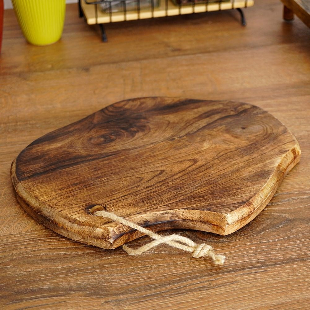 Exotic mango wood kitchen board - unique aged look and shape