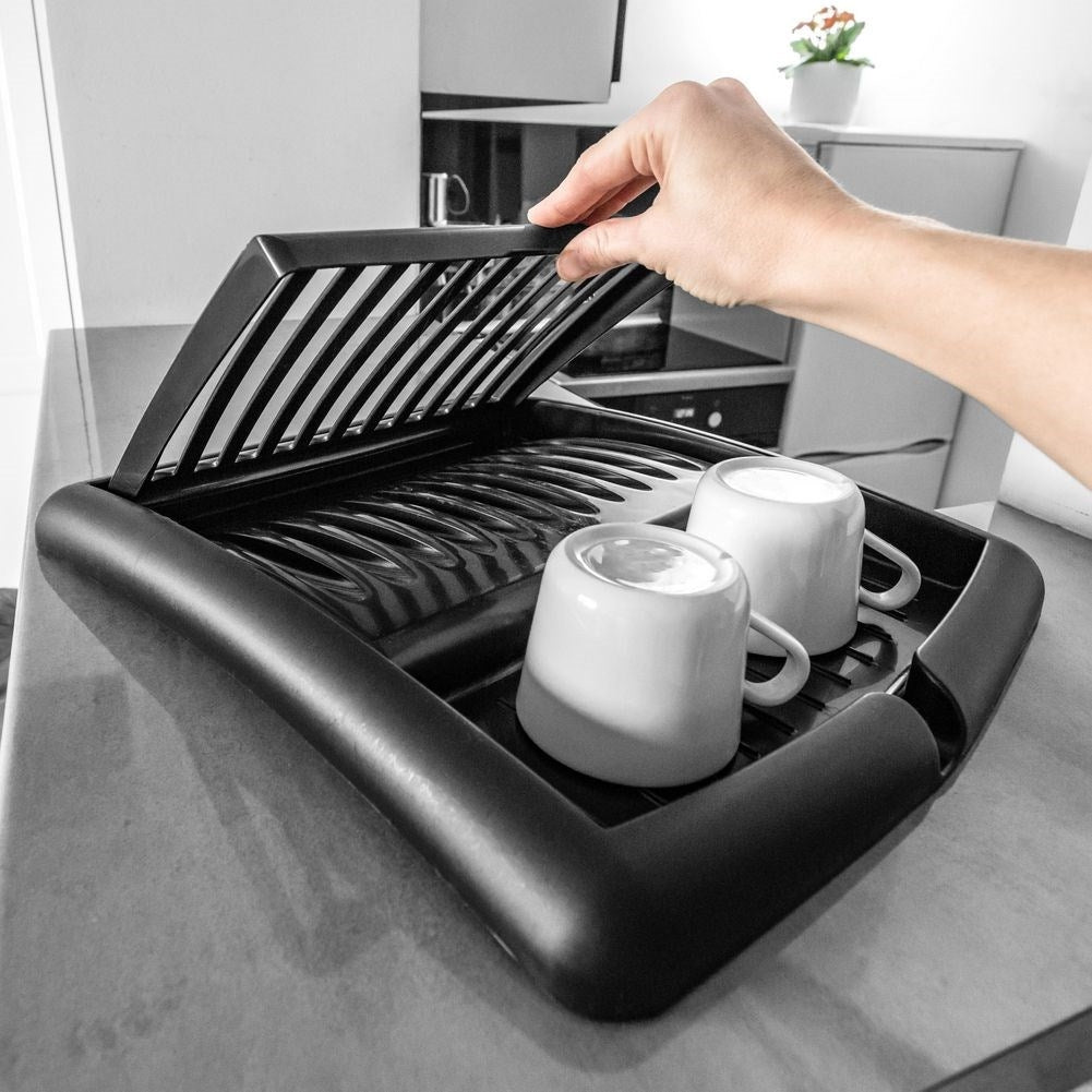 Extendable black dish rack with space for plates and glasses