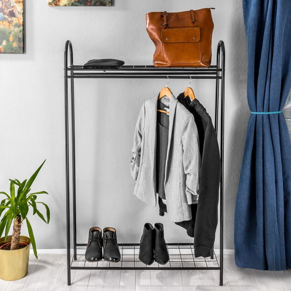 Floor-standing clothes hanger with shelves