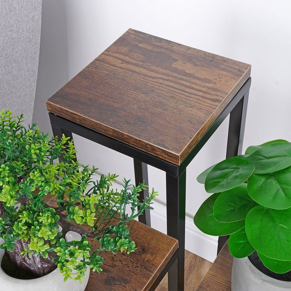 Flower arrangement in metal with four levels for plants and decoration