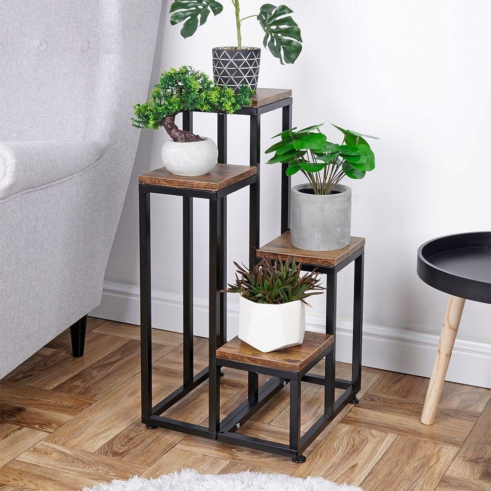 Flower arrangement in metal with four levels for plants and decoration