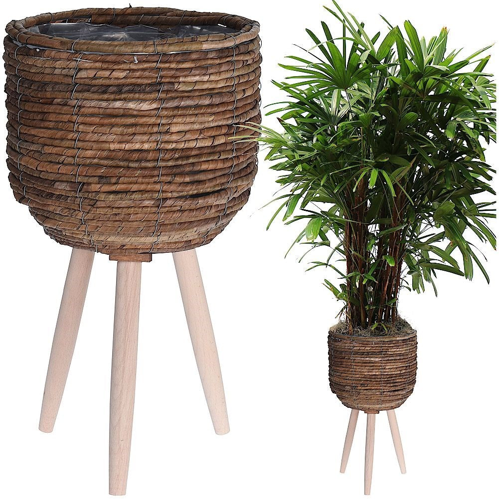 Flower pot on wooden legs, braided from natural materials