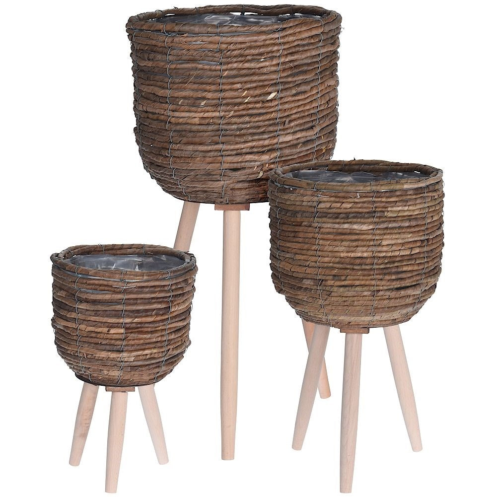 Flower pot with wooden legs and natural materials