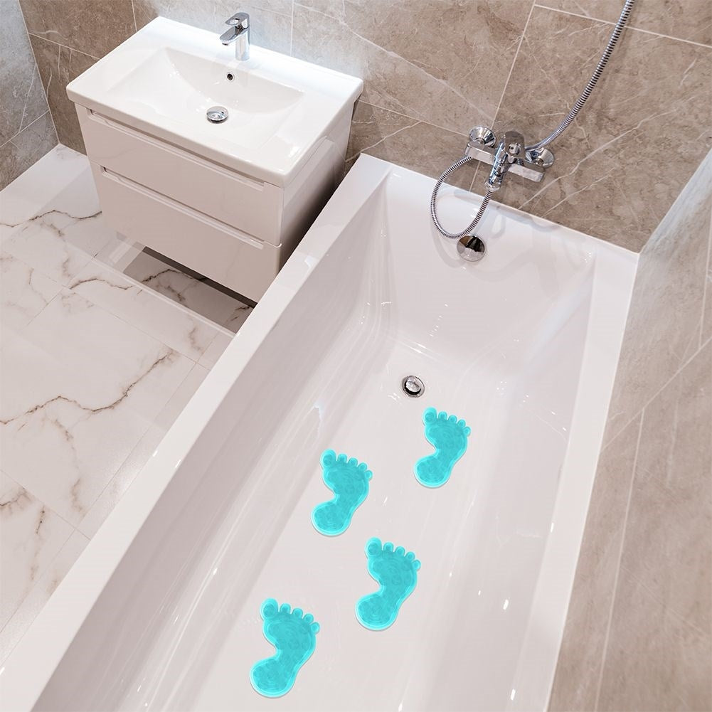 Four blue non-slip mats with suction cups for shower/bathtub