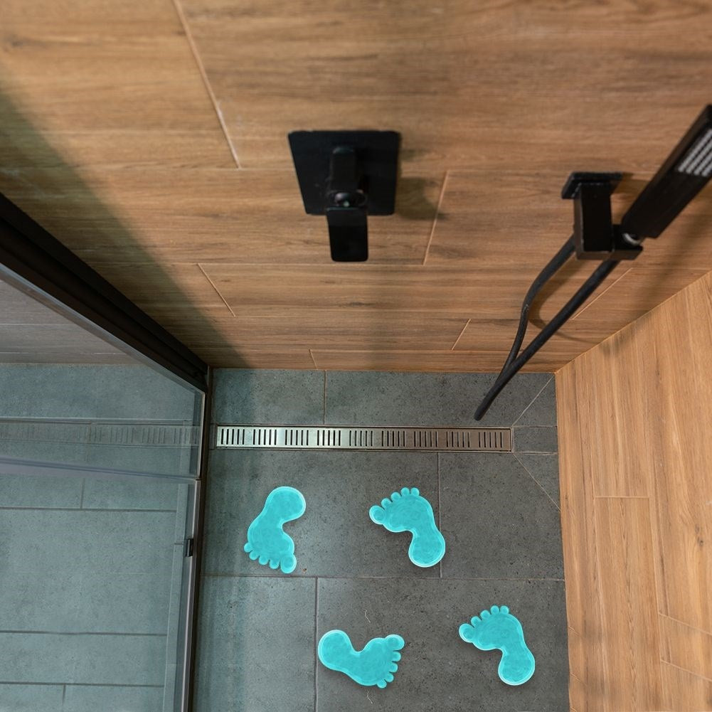Four blue non-slip mats with suction cups for shower/bathtub