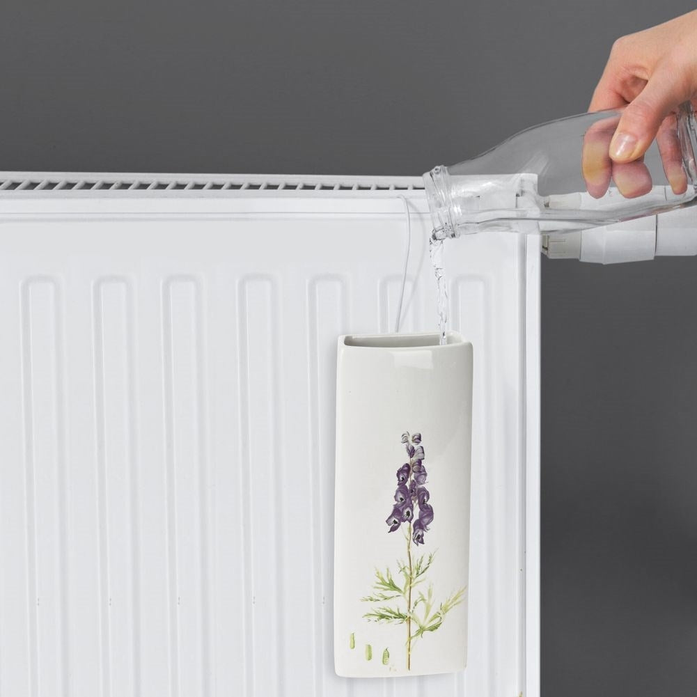 Four ceramic humidifiers with floral decorations for elements
