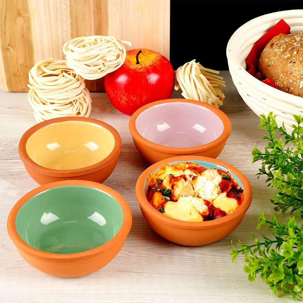 Four colorful stoneware baking tins for all dishes