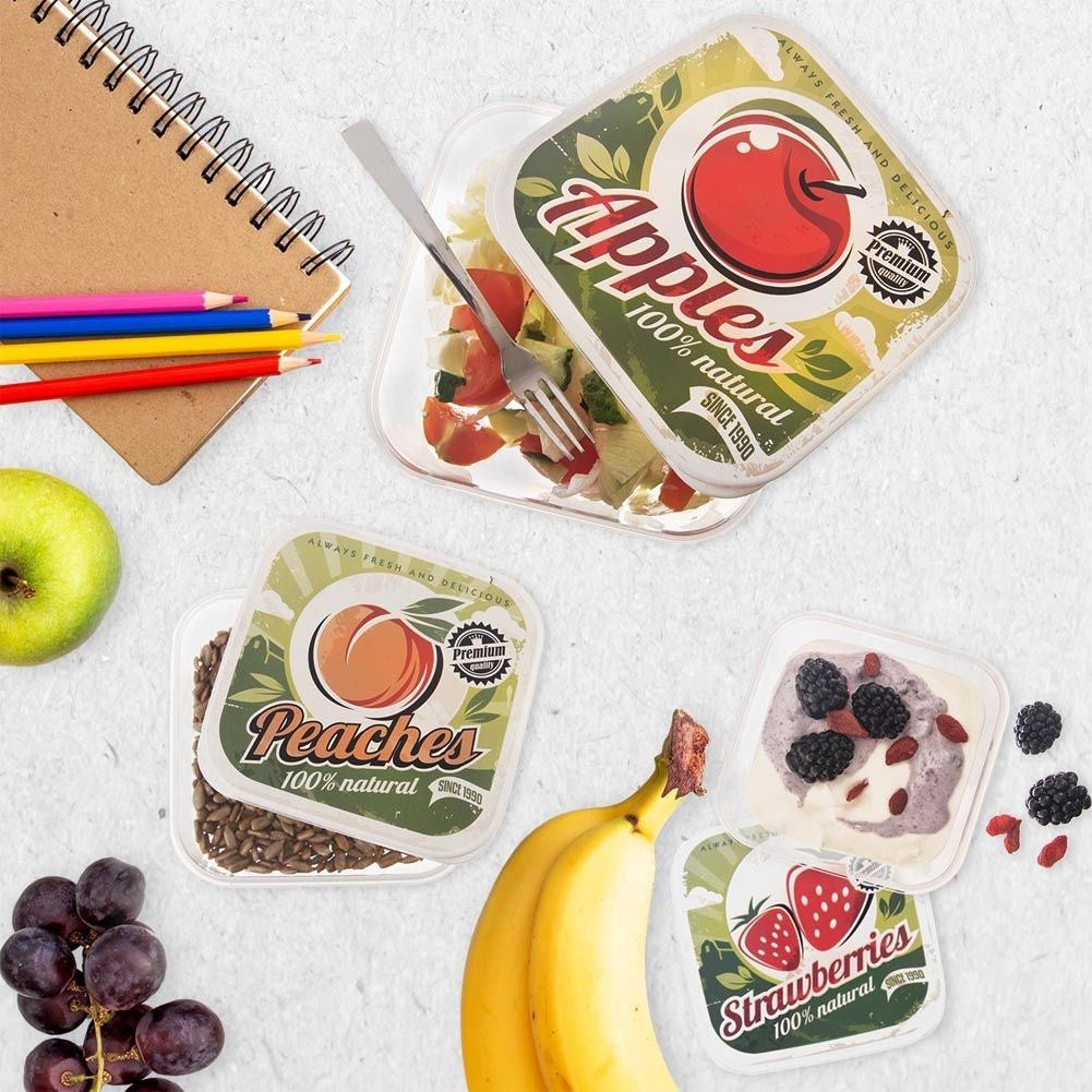 Four food boxes with fruit motifs in different sizes