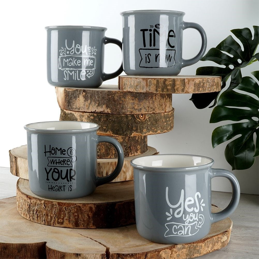 Four gray porcelain mugs with text, dishwasher safe