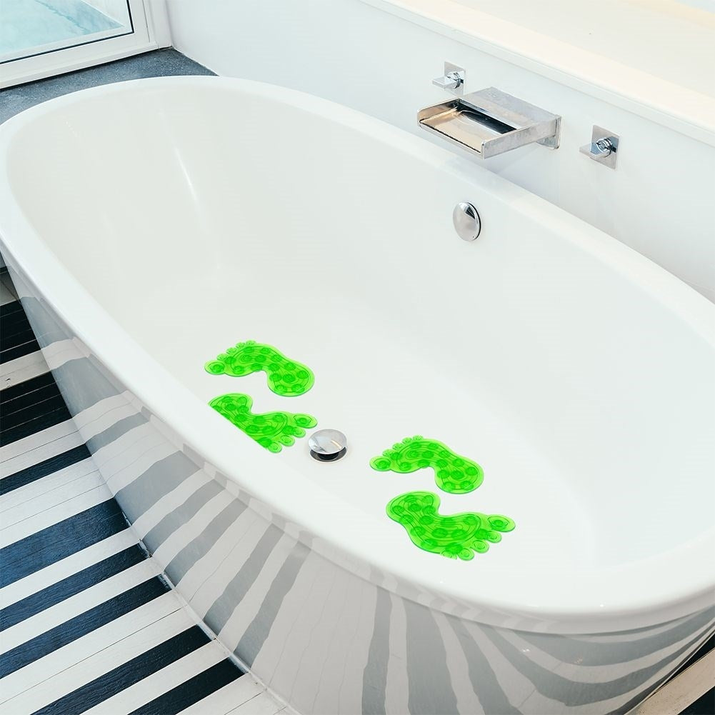 Four green non-slip mats with suction cups for shower/bathtub