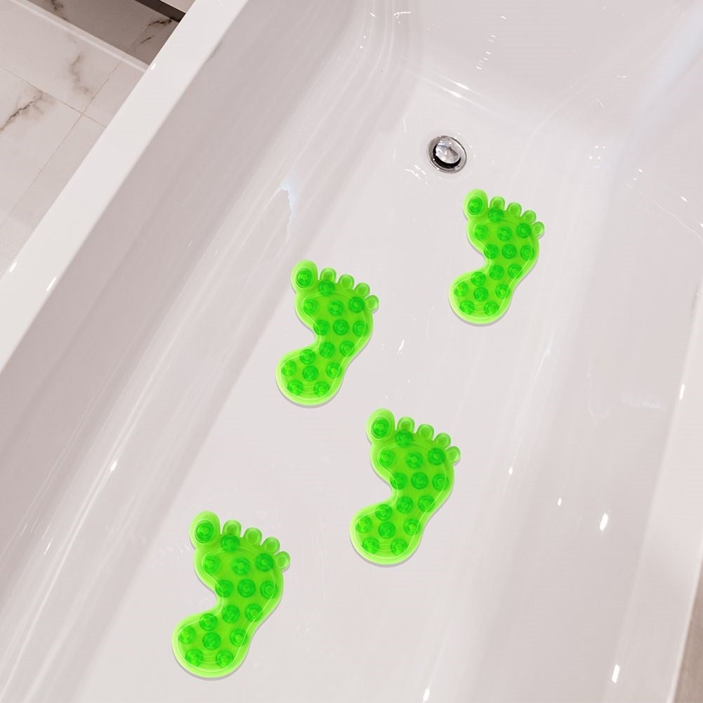 Four green non-slip mats with suction cups for shower/bathtub