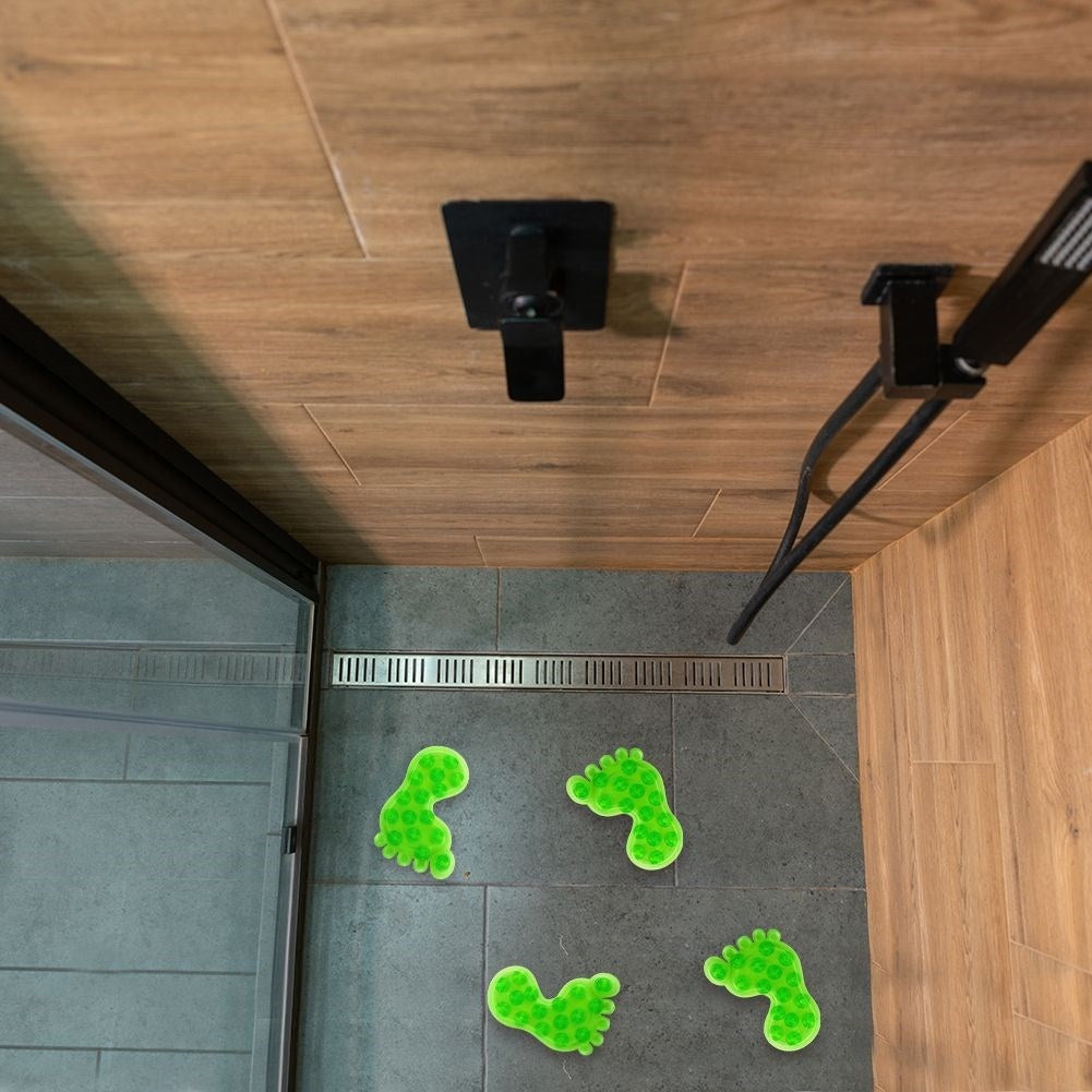 Four green non-slip mats with suction cups for shower/bathtub