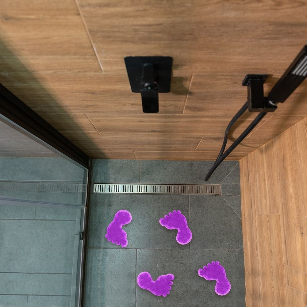 Four purple anti-slip mats with suction cups for shower/bathtub