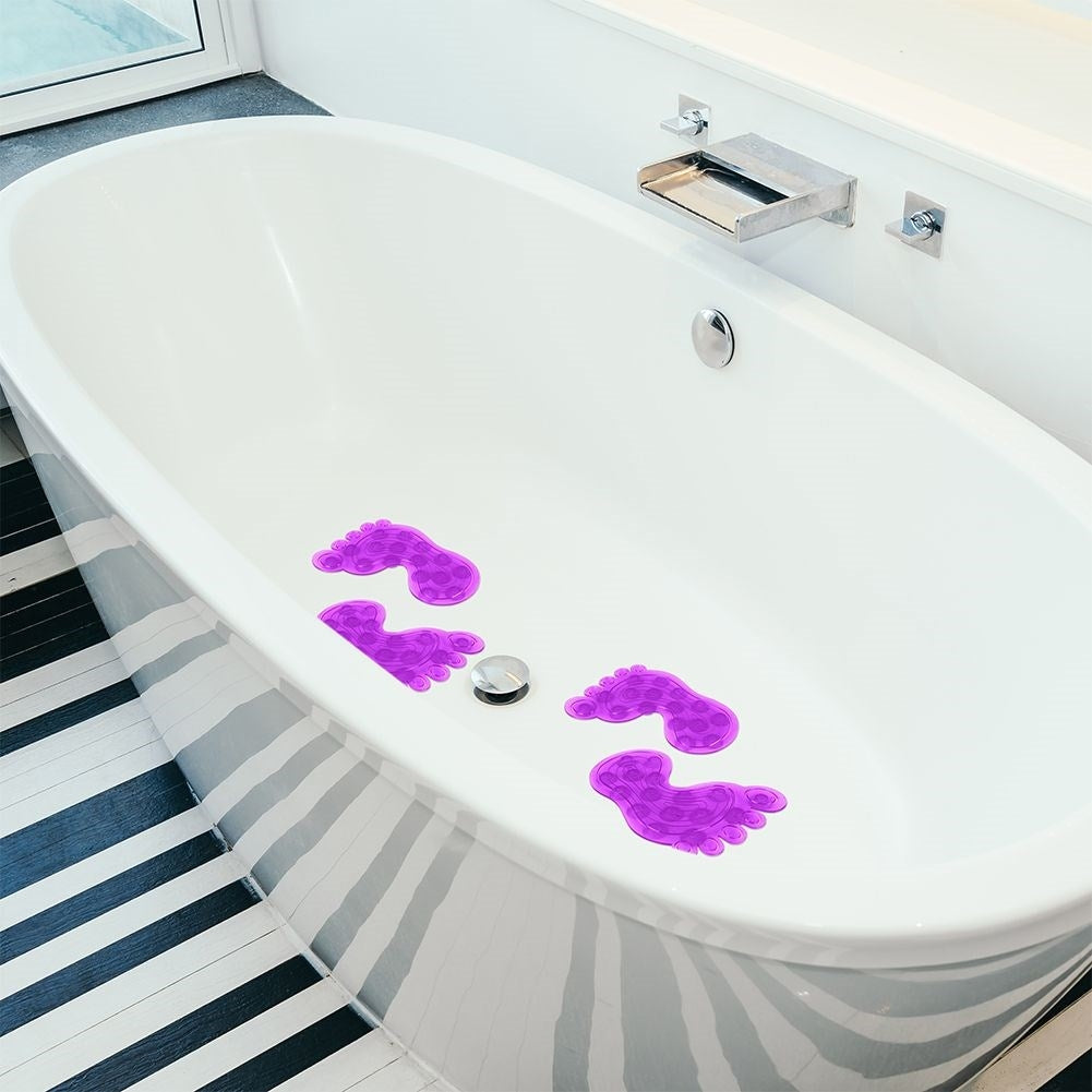 Four purple anti-slip mats with suction cups for shower/bathtub