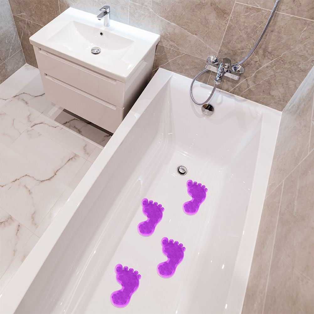 Four purple anti-slip mats with suction cups for shower/bathtub