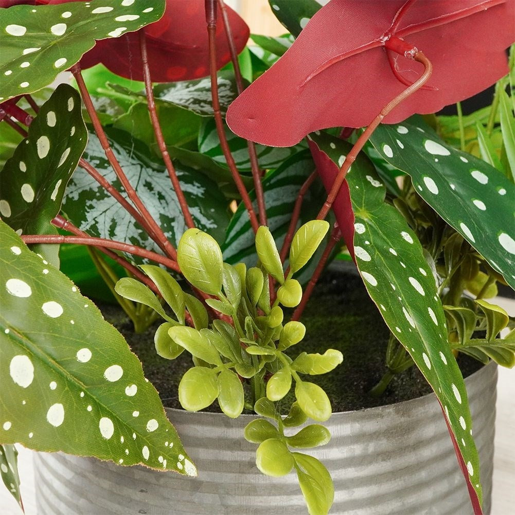 Four realistic artificial plants in pots without care