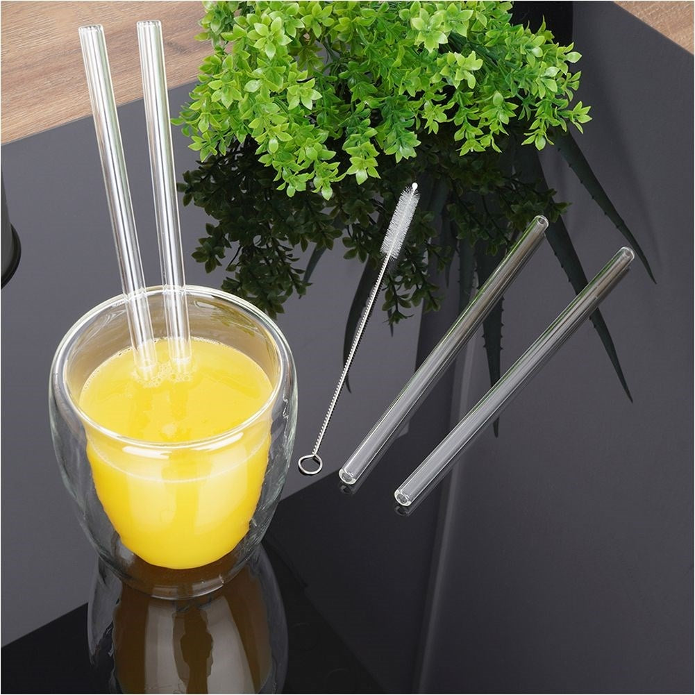 Four reusable glass straws with cleaning brush