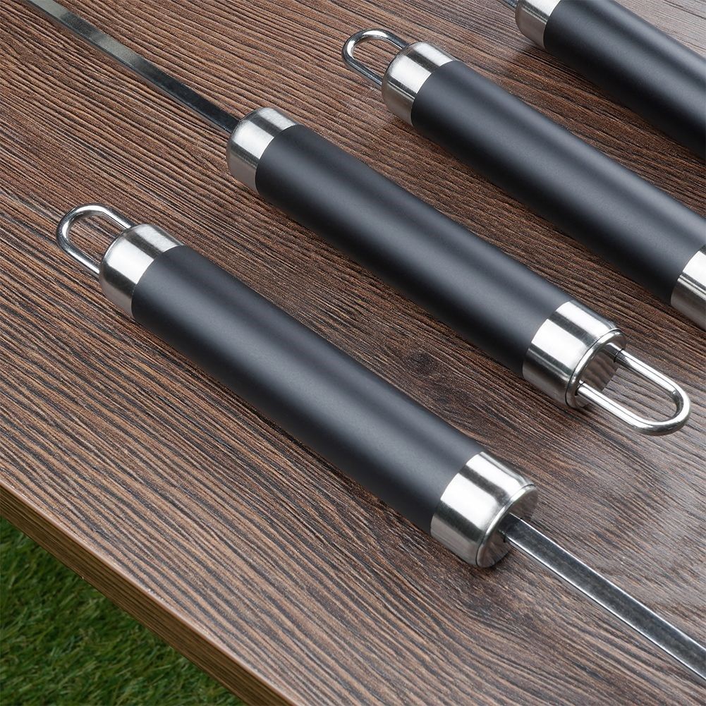 Four stainless steel grill skewers for delicious vegetable and meat skewers