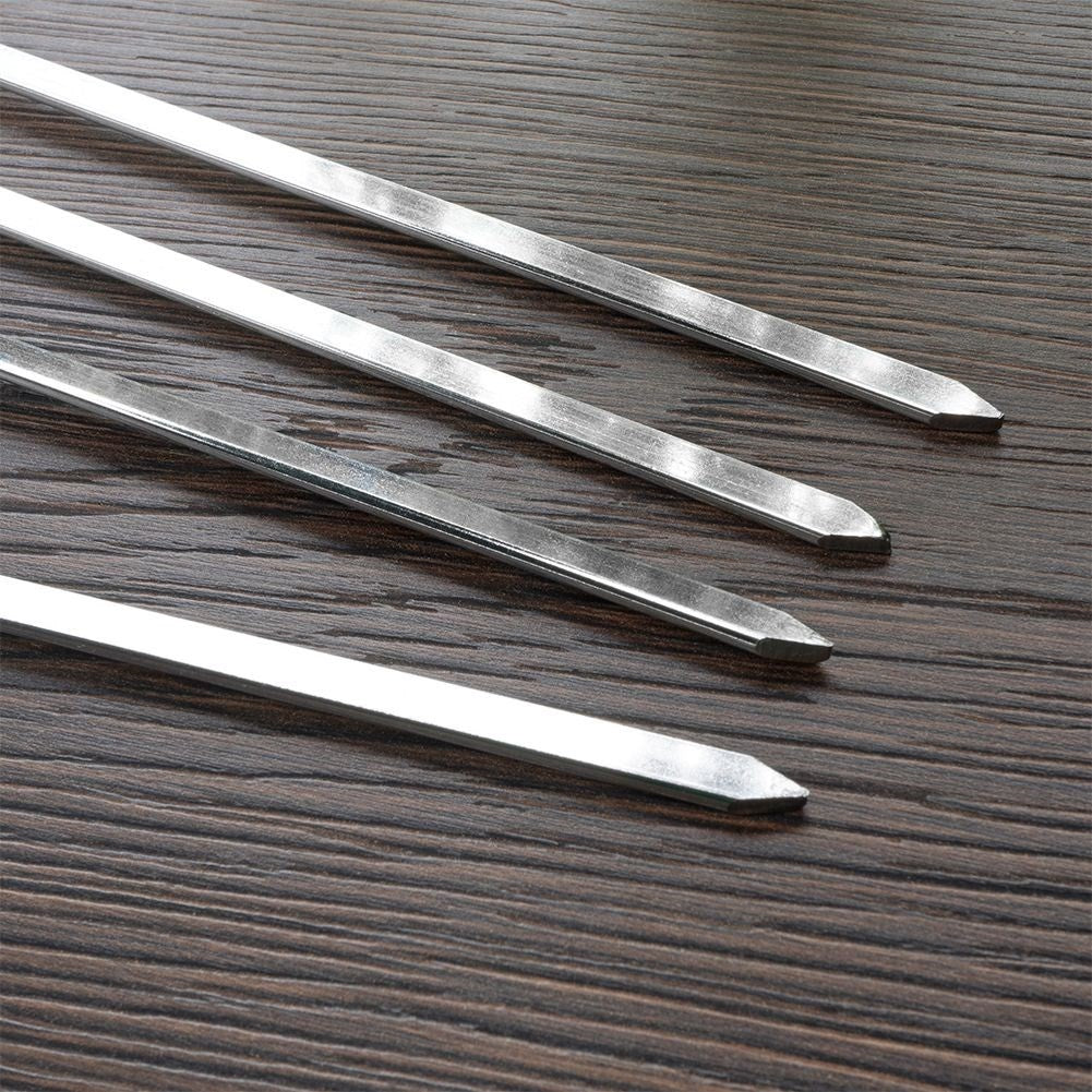 Four stainless steel grill skewers for delicious vegetable and meat skewers