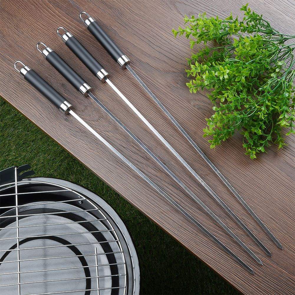 Four stainless steel grill skewers for delicious vegetable and meat skewers